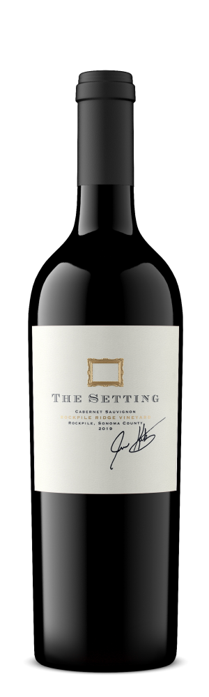 Bottle of The Setting Rockpile Ridge Vineyard Cabernet Sauvignon 2021 750 ML with vineyard background