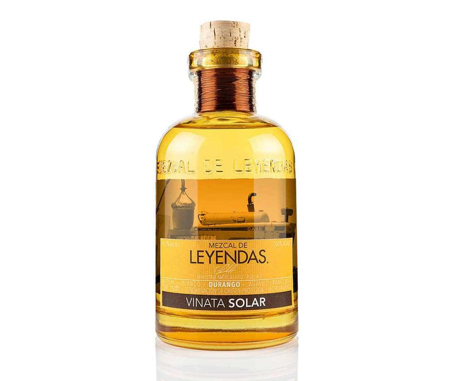 Mezcal De Leyendas Vinata Solar artisanal mezcal bottle with golden amber liquid and cork stopper