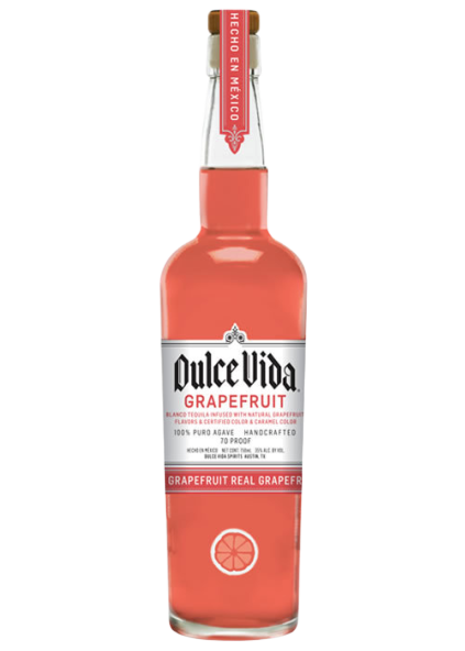 Bottle of Dulce Vida Grapefruit Tequila 750 ML with fresh grapefruit slices and a cocktail glass
