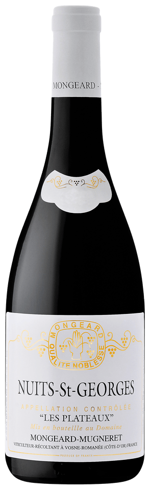 Bottle of Nuits-St-Georges wine with a white label on a black background