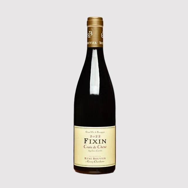 Bottle of Regis Bouvier Fixin 2022 red Burgundy wine showcasing elegant Pinot Noir from Côte de Nuits.