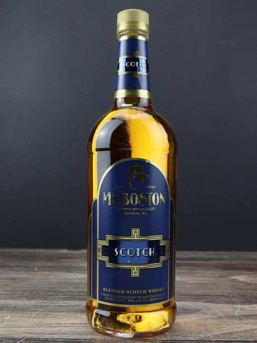 Mr. Boston Blended Scotch Whisky 1L bottle with blue and gold label on wooden surface