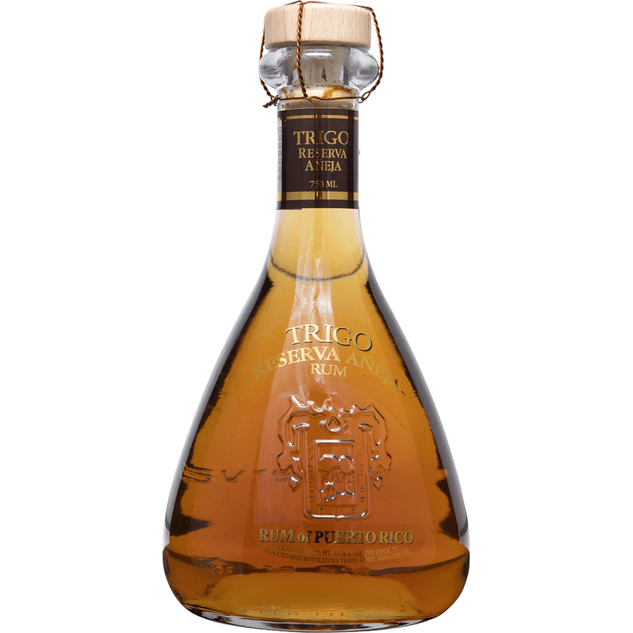 Trigo Reserva Anejo 750 ML bottle with amber hue and elegant design.