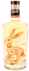 Suerte Reposado Tequila 100% de Agave 750ml bottle with golden liquid and decorative rabbit design
