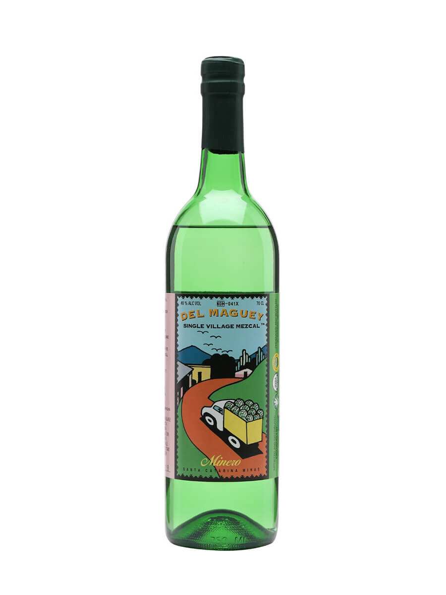 Del Maguey Mezcal Single Village Minero bottle with traditional clay pot distillation background